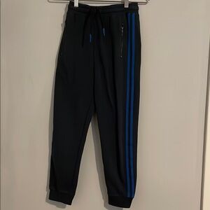 Kids size 12 Navy Jogger Pants with Blue Stripes. Zip pockets.